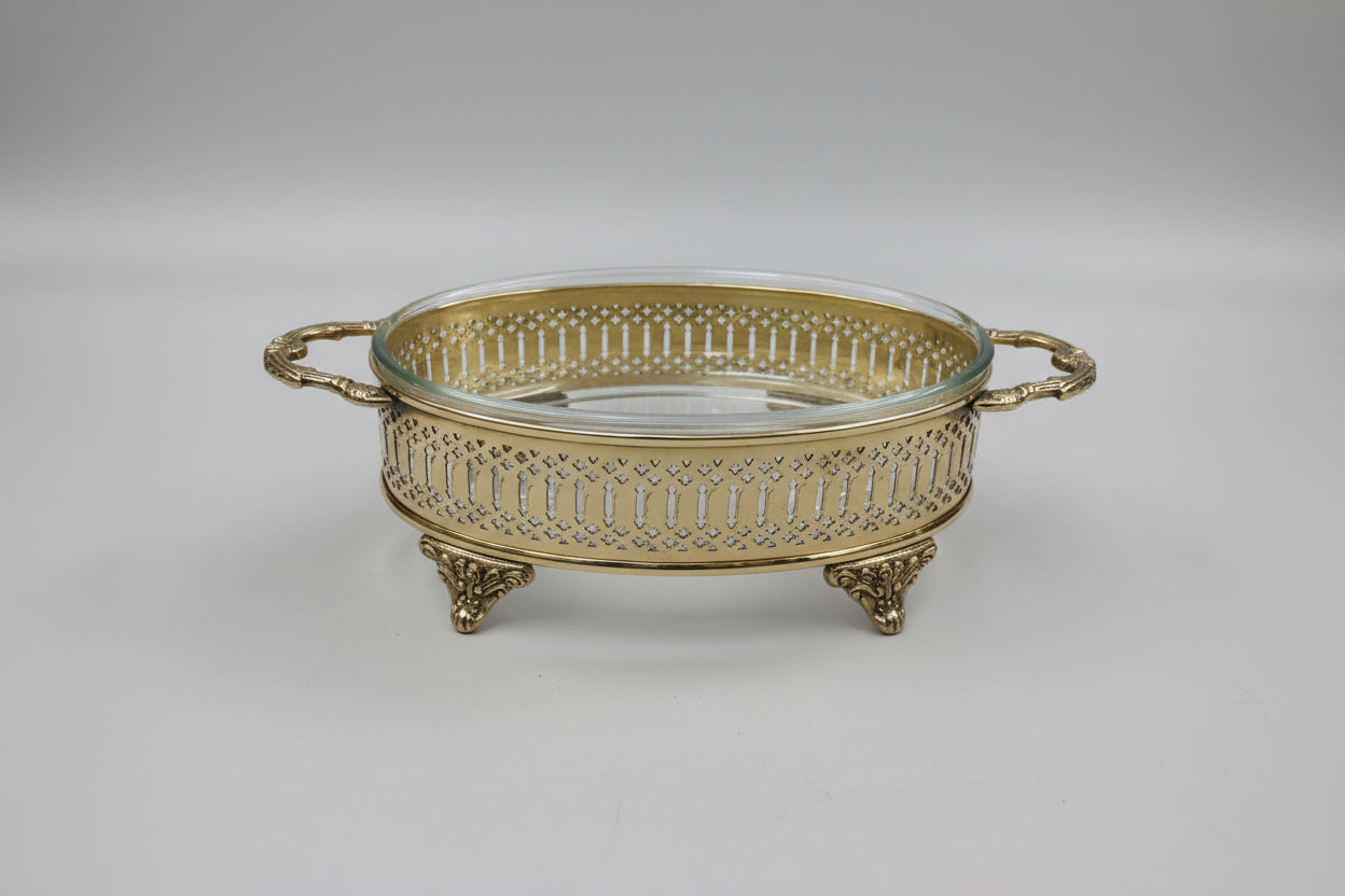 Brass oval casserole with hand-pierced jali lattice work and clear glass insert — heritage Indian serveware