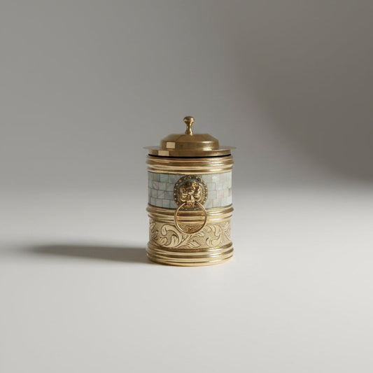 Brass lidded canister with mother of pearl band and sculpted lion-head ring handle — heritage Indian storage decor
